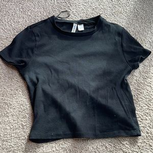 Large, black ribbed, crop top.